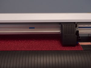 A Graphtec plotter cutter cutting Pressure Sensitive GlitterFlex Ultra