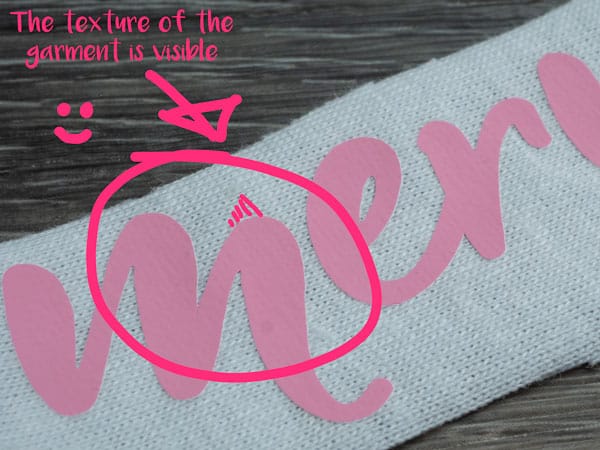 This shows a good press of ThermoFlex Plus- you can see the texture of the garment in the Plus, meaning it got enough pressure.