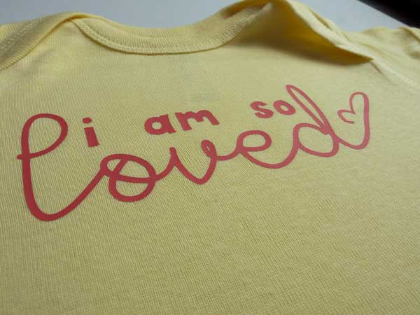 A closeup of the finished project- the design reads "I am so loved" made with ThermoFlex Plus