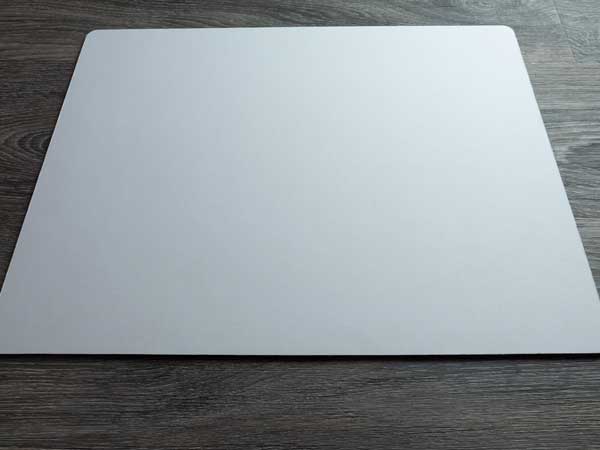 A heat resistant surface that's ready to have the pressed garment placed on top of it