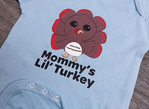 Image depicting the downloadable cut file that says "Mommy's Lil' Turkey" with a cute turkey