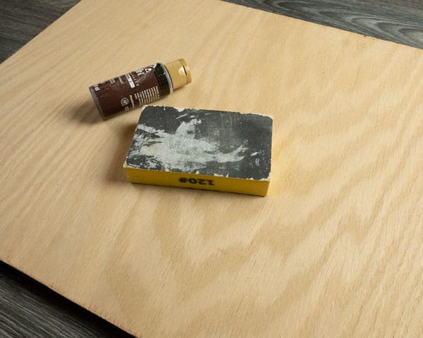 The supplies needed for this project- sandpaper, paint, and wood. Not pictured- ThermoFlex Turbo HTV and baby wipes.