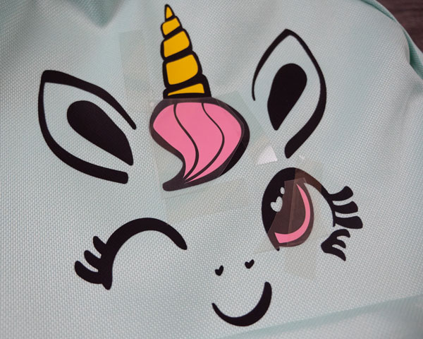 Showing the layering of the materials on the unicorn face design