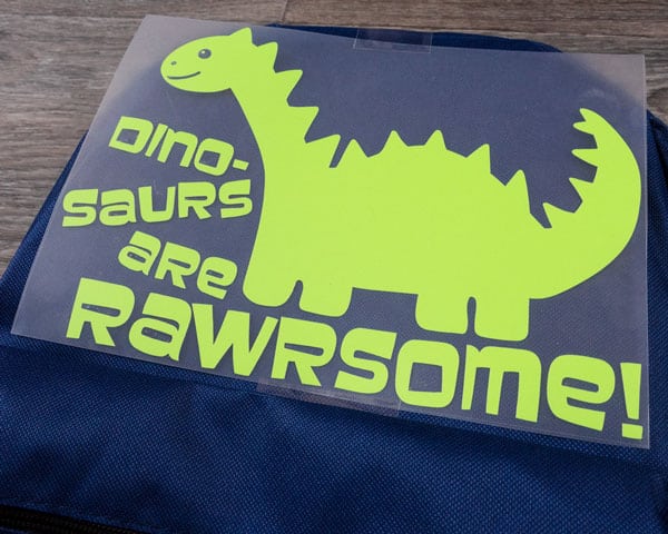 The dinosaur weeded before being pressed onto the backpack