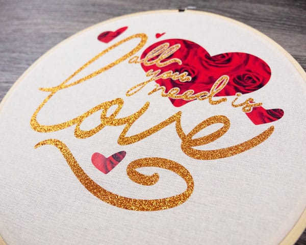 A close up picture of the embroidery hoop finished with the ThermoFlex® Fashion Patterns and GlitterFlex® Ultra