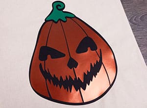 The Jack-o-Lantern cut file pressed onto a bag