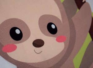 A close up of Subli-Flock showing the flocky texture- the printed image is of a cute sloth
